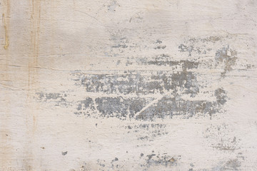 Wall fragment with scratches and cracks