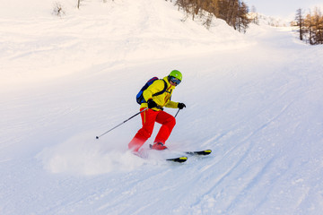 Fototapeta na wymiar Image of sports man skiing on snowy slope