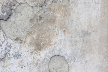 Wall fragment with scratches and cracks