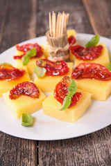 polenta and dry tomato, finger food
