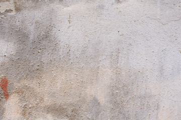 Wall fragment with scratches and cracks