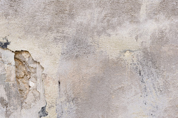 Wall fragment with scratches and cracks