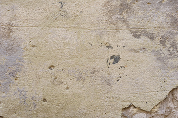 Wall fragment with scratches and cracks