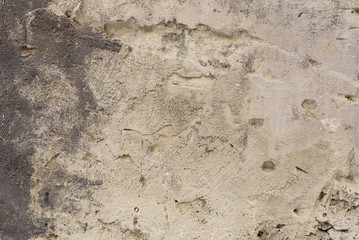 Wall fragment with scratches and cracks