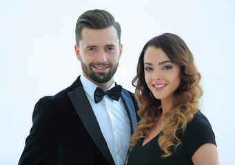 Portrait of a handsome man looking at the camera with a woman