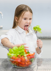 little girl refuses to eat vegetable