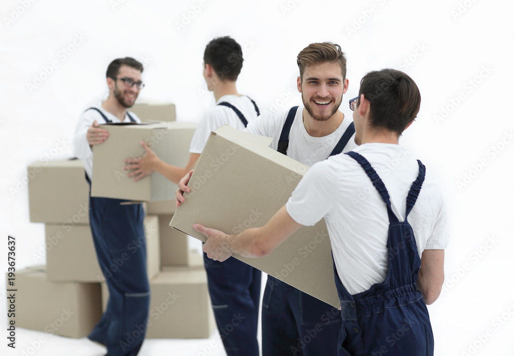 Wall mural portrait of movers holding box smiling isolated on white backgro