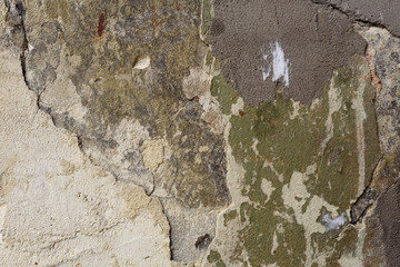 Wall fragment with scratches and cracks