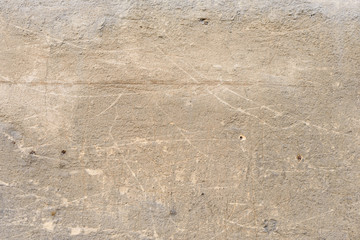Wall fragment with scratches and cracks