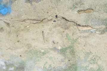 Wall fragment with scratches and cracks