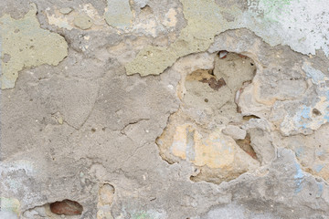 Wall fragment with scratches and cracks