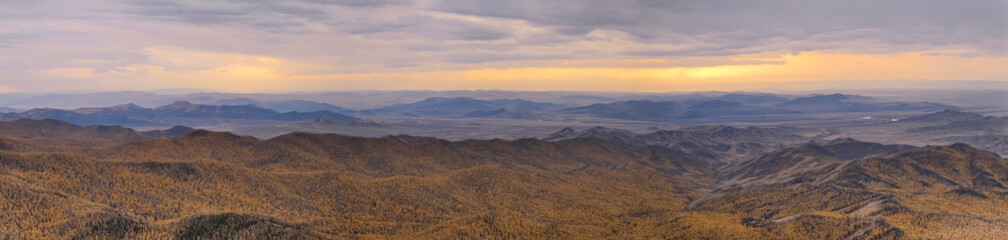 Fototapeta na wymiar Mountain landscape with helicopter sunset