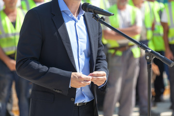 Politician or business person is giving a speech