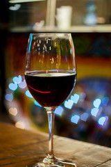 a glass of red wine with the Boke 