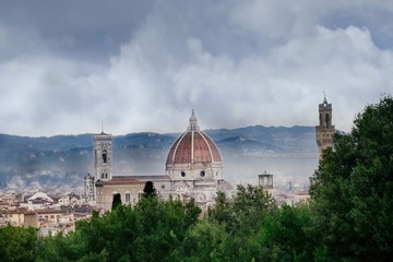 Fototapeta na wymiar rainy day in Florence, the sky with dark clouds over the dome of the Cathedral of Santa Maria del Fiore and the bell tower of Giotto