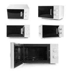 Set of microwave ovens on white background