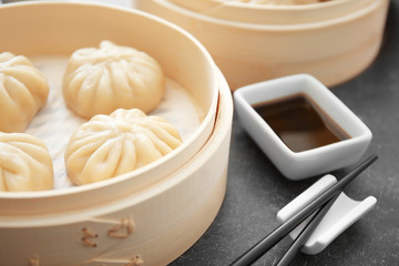 Raw baozi dumpling on white background
