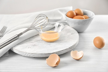 Composition with chicken eggs on table