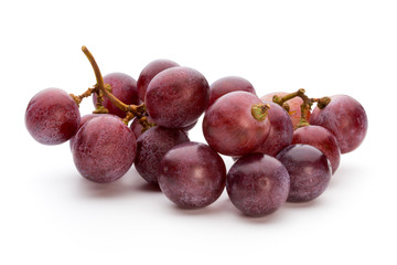 Ripe red grape isolated on white.