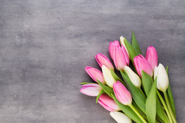 Mother's Day, woman's day, easter, pink tulips, presents on gray  background.