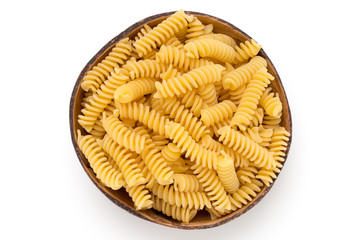 Uncooked fusilli pasta isolated white background.