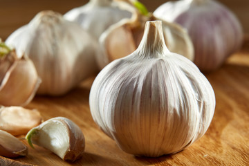 Garlic close up on rustic wooden background, shallow depth of field, selective focus, macro