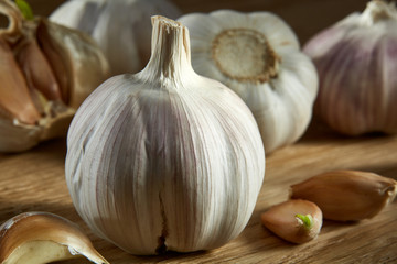 Garlic close up on rustic wooden background, shallow depth of field, selective focus, macro