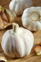 Garlic close up on rustic wooden background, shallow depth of field, selective focus, macro