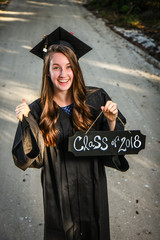 Girl Graduating High School with Cap Gown