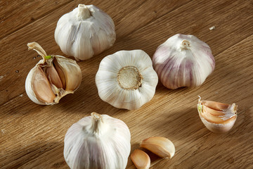 Garlic close up on rustic wooden background, shallow depth of field, selective focus, macro