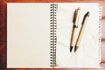 Brown leather table with supplies