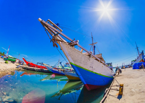 Traditional boats in Paotere harbor, Makassar, Indonesia. Indonesian sailor have been using this kind of boat called Pinisi to sail as far as Africa since 14 century.