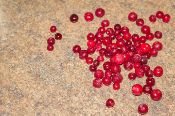 Cold frozen red berry cranberries on the table