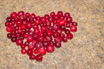 Cold frozen red berry cranberries on the table