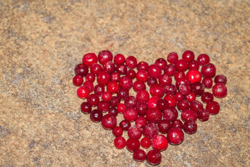 Cold frozen red berry cranberries on the table