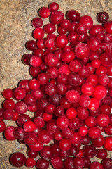 Cold frozen red berry cranberries on the table