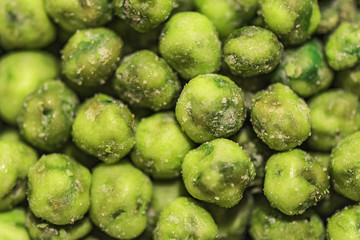 Seamless bright green wasabi peas shot close up.
