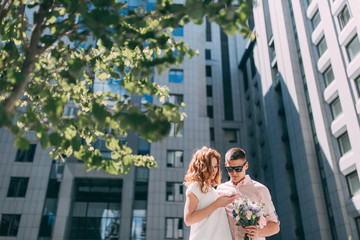 Fototapeta premium romantic meeting a newlyweds couple in a megapolis