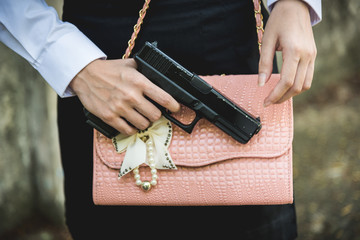 Young woman with concealed weapon