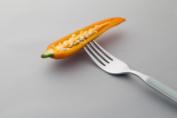 Yellow Chili pepper on a fork