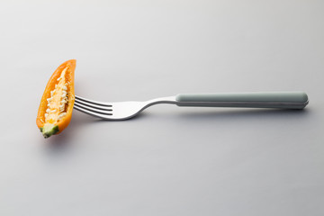 Yellow Chili pepper on a fork