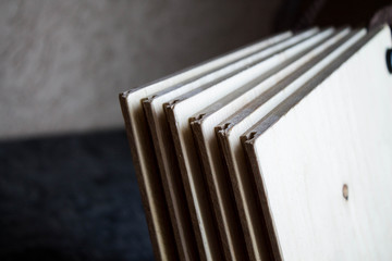 Samples of laminate and parquet board. Selection and types of floor coverings.