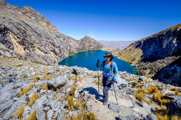 Young woman hiking near Churup Lake in the Huascaran National Park, Peru.