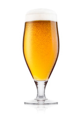 Cold glass of lager ale beer with foam and dew