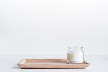 Bamboo tray with white candle