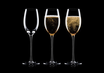 Elegant glasses of yellow champagne with bubbles