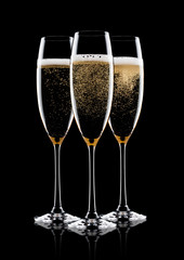 Elegant glasses of yellow champagne with bubbles
