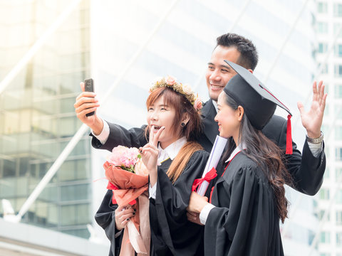 Businessman and twin woman portrait smiling and selfie photo on her graduation day