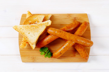 thin sausages with toast