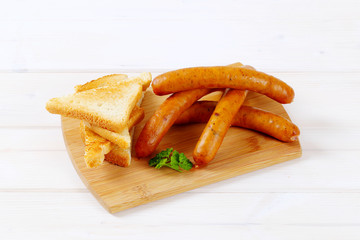 thin sausages with toast